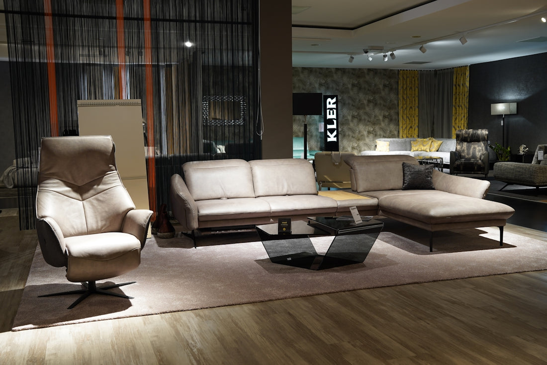 a living room filled with furniture on top of a hard wood floor