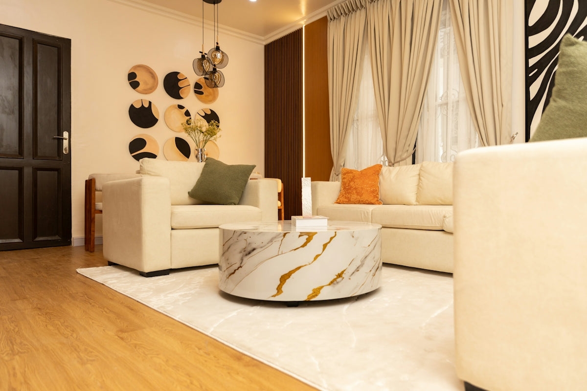 Modern living room with cream sofas and marble coffee table